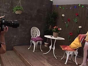 Busty blonde lesbians Cindy Behr and Paige Ashley share dildos after photoshoot