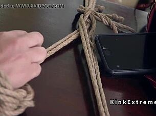 Huge chested submissive gets restrained and handled in a bondage session