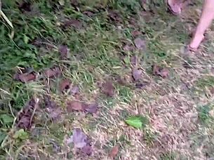 Naughty redhead punk flashes shaved pussy without panties in public park outdoors