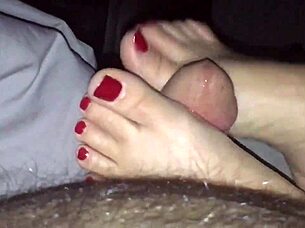 This sexy milf delivers an epic footjob with her hot red painted toes until cumshot explodes 💦👣