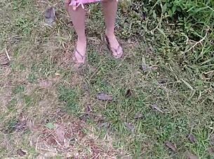 Naughty redhead punk flashes shaved pussy without panties in public park outdoors