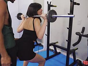 She works out hard at the gym, getting spanked and fucked roughly by muscular bodybuilder.