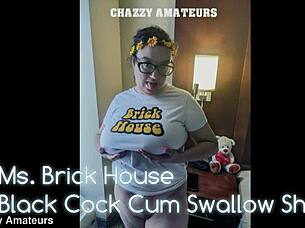 Oh yeah, watch Ms. Brick swallow that black cock cum after tit play!