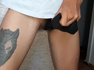 She thrusts a dildo into her hairy pussy while I stroke my shaved one to orgasm