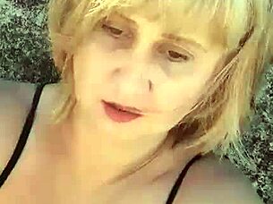 blonde milf with big natural tits spreads huge pussy lips and nipples on beach fetish