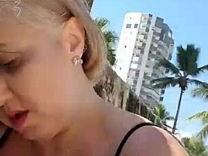blonde milf with big natural tits spreads huge pussy lips and nipples on beach fetish