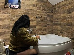 i can't believe this milf is peeing in the bathtub with fur coat and pantyhose on!