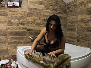 i can't believe this milf is peeing in the bathtub with fur coat and pantyhose on!