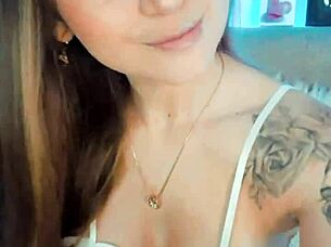 The cute cosplay girl in costume smiles sweetly on webcam like a playful whore.