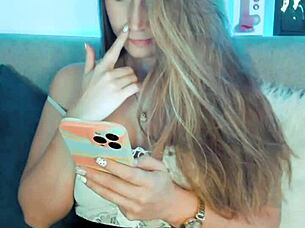 The cute cosplay girl in costume smiles sweetly on webcam like a playful whore.