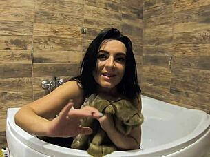 i can't believe this milf is peeing in the bathtub with fur coat and pantyhose on!