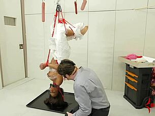 Suspended in bizarre bondage at the garage like raw meat forced into intense ass licking and cum eating with ebony doctor flair.