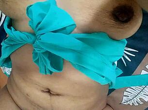 In this homemade video, the muscular Latina gives herself a sensual massage on her big tits and juicy pussy, moaning as she squirts in the bedroom.