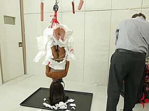 Suspended in bizarre bondage at the garage like raw meat forced into intense ass licking and cum eating with ebony doctor flair.