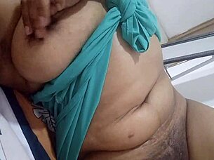 In this homemade video, the muscular Latina gives herself a sensual massage on her big tits and juicy pussy, moaning as she squirts in the bedroom.