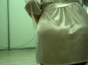 A chubby mature housewife struts around in a short robe, her thick ass and big saggy boobs jiggling freely.