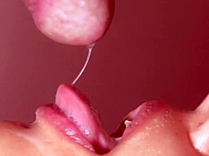 Hot woman gives me a blowjob with close up cum in mouth action.