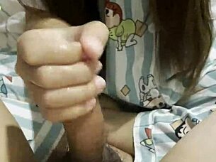 asian girl gives her boyfriend an amazing handjob in bedroom 🍆✋