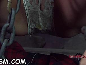 Babe in Latex Costume Gets Punished in Garage Bondage