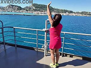 Woman in public place recalls her beach vacation memories