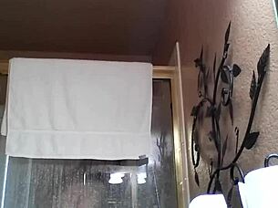 An Asian amateur enjoys a relaxing shower during bath time.