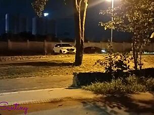 Hey, check out this hot big-ass chick jerking off that massive cock right in the middle of the square!