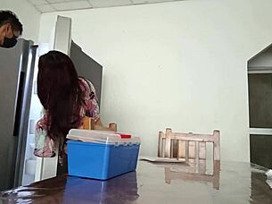 Maintenance Man Inspects Refrigerator as Housewife Boldly Displays Vagina on Table in Homemade Scene
