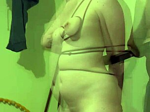 Using a ruler for spanking during intense session with machine