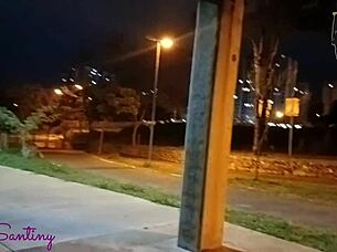 Hey, check out this hot big-ass chick jerking off that massive cock right in the middle of the square!