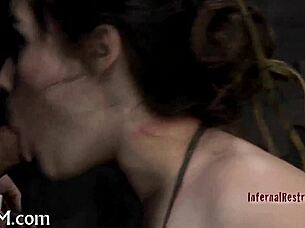 Why wear a metal cage helmet during this intense BDSM domination session?