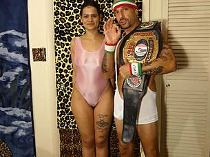 Pornstar champion takes on women in full nelson wrestling hold during erotic New Zealand challenge match.