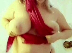 Mature woman shows off huge tits and big pussy lips in lingerie
