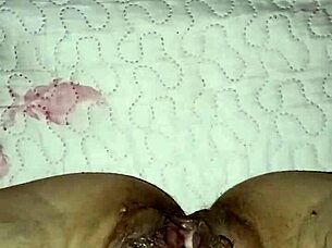 Gretala flashes her open pussy while he snores nearby in teasing display