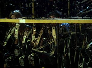 Will this passionate couple fuck wildly in boots amid warehouse auto parts