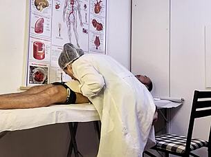 Why does the patient get hard during nurse exam and tease her?