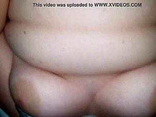 She teases her wife's juicy wet pussy with a vibrating toy until climax.