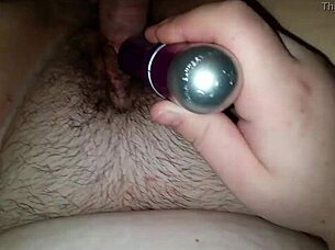 She teases her wife's juicy wet pussy with a vibrating toy until climax.