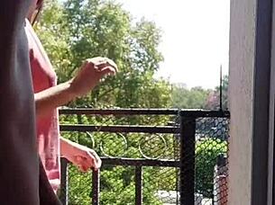 Having passionate sex on the home balcony while workers watch