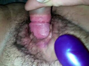 She teases her wife's juicy wet pussy with a vibrating toy until climax.