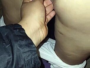 Mature woman with big ass walks down the street in thong under transparent leggings.