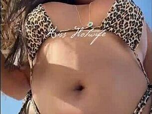 I love showing off my huge tanned ass in this tiny bikini at the beach