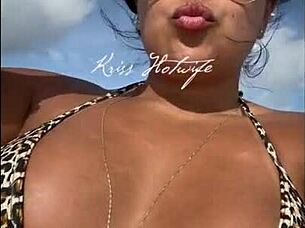 I love showing off my huge tanned ass in this tiny bikini at the beach