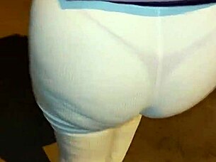 Mature woman with big ass walks down the street in thong under transparent leggings.