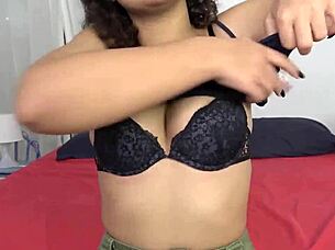 An 18-year-old Moroccan teen experiments casually with a big dildo in her solo session.