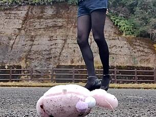A Japanese crossdresser explores crush fetish with soft toy in Asian scene