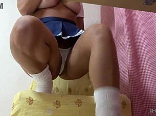 oh man, i cant stop starin at this tanned japanese girls micro thong wedgie sittin on chair... her ass and cameltoe in costume just drivin me wild with them legs and upskirt view