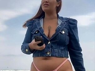 On the beach, she flashed him until he got rock hard, then grabbed and felt his impressive size for herself.