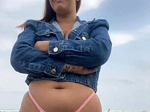 On the beach, she flashed him until he got rock hard, then grabbed and felt his impressive size for herself.