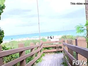 Young adult competes in a sucking contest game with intense action and excitement.