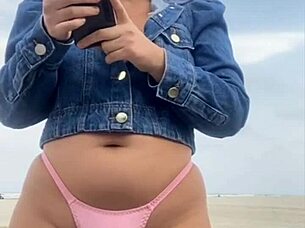 On the beach, she flashed him until he got rock hard, then grabbed and felt his impressive size for herself.